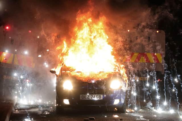 A car explodes after being hijacked and set on fire by loyalists in the Tigers Bay area in Belfast this evening. 

Photo by Kelvin Boyes  / Press Eye.