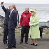 GIANTS CAUSEWAY, NORTHERN IRELAND - JUNE 28: Queen Elizabeth II and Prince Philip, Duke Of Edinburgh are escorted by Bob Brown from the National Trust of Northern Ireland and guide Neville Mconachie during a visit to the Giants Causeway on June 28, 2016 in County Antrim, Northern Ireland, United Kingdom.  (Photo by Arthur Edwards/WPA Pool/Getty Images)