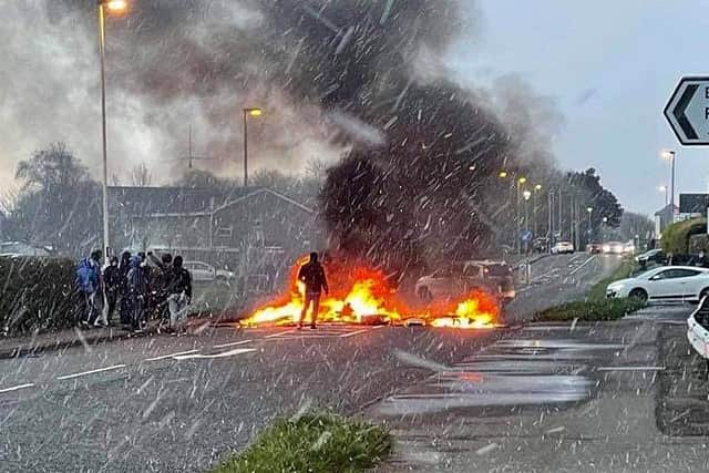 Youths block the Portrush Road in Coleraine with a burning barricade