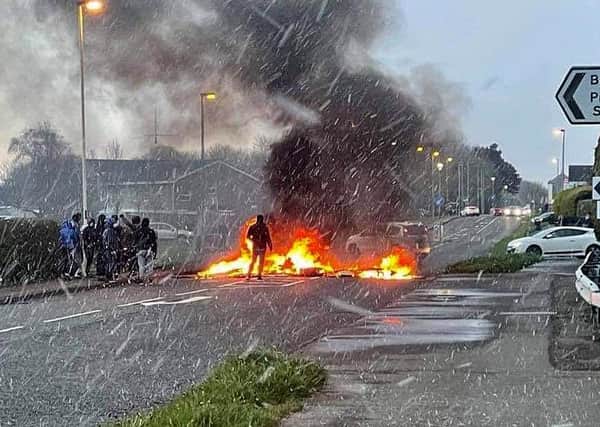 Youths block the Portrush Road in Coleraine with a burning barricade