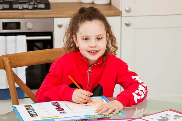 Pictured here Ava McKinlay works on the activity pack to plan her own story
