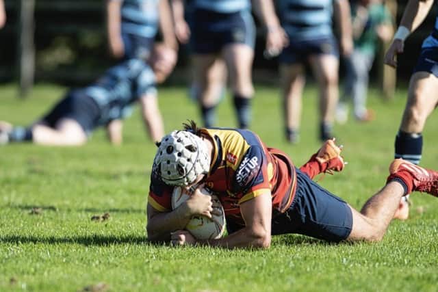 Scoring a try for Ballyclare.