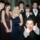 "Thumbs-up" for all systems go at the recent Loretto College formal eveing for these fun-loving students.