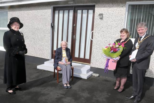Isabelle Claypole, who celebrated her 100th birthday on April 10th 2021, receives her commemorative centenary coin from the Mayor of Causeway Coast and Glens Borough Council Alderman Mark Fielding and Mayoress Mrs Phyllis Fielding. Also included in the pictured is Lady Karen Girvan