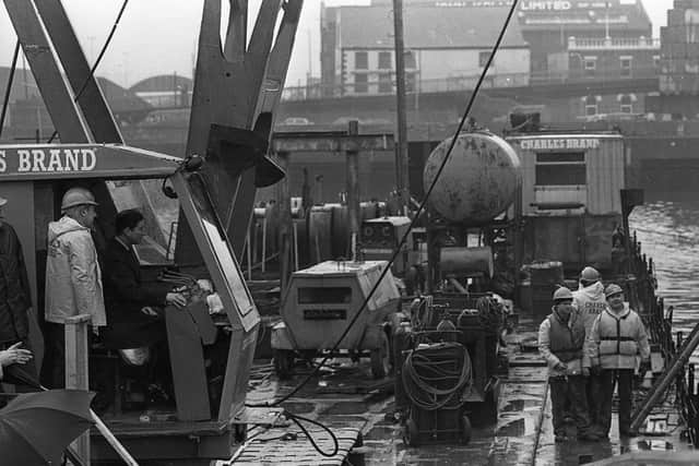 Prince Charles lets the crane take the strain at the multi-million pound Lagan Weir project during his visit to Northern Ireland in March 1991. Pictures: Trevor Dickson and Cecil McCausland/News Letter archives