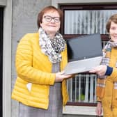 Granaghan District Women’s Group chair, Deirdre Bradley and secretary, Ann McNicholl with a laptop purchased for the group with a community grant provided by the Housing Executive.