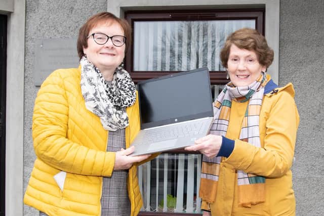 Granaghan District Women’s Group chair, Deirdre Bradley and secretary, Ann McNicholl with a laptop purchased for the group with a community grant provided by the Housing Executive.