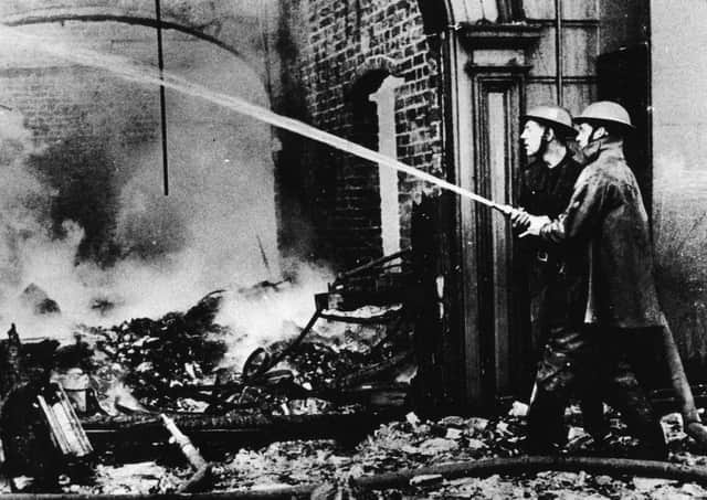 Soldiers try to make safe blitzed premises in Belfast after the May 4/5, 1941, raid by the German Luftwaffe. Picture: News Letter archives