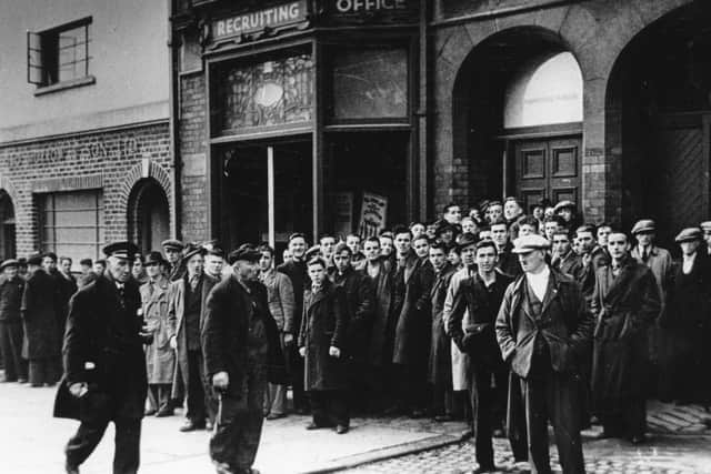Citizens of Belfast queue outside recruiting office in Belfast during the Second World War. Picture: News Letter archives