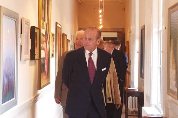 Prince Philip admires the art in the new Gallery at Hillsborough Castle during his visit to present the Duke of Edinburgh Gold awards.
PICTURE BY STEPHEN DAVISON