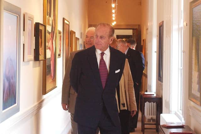 Prince Philip admires the art in the new Gallery at Hillsborough Castle during his visit to present the Duke of Edinburgh Gold awards.
PICTURE BY STEPHEN DAVISON
