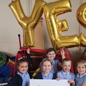 Pupils at Carrickfergus Central Primary School celebrate the results of the parental ballot which took place in June 2019.