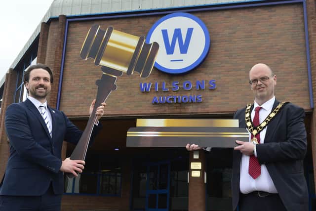 Mayor of Antrim and Newtownabbey, Cllr Jim Montgomery launches his online charity auction with Wilsons Auctions auctioneer, John Ardill.