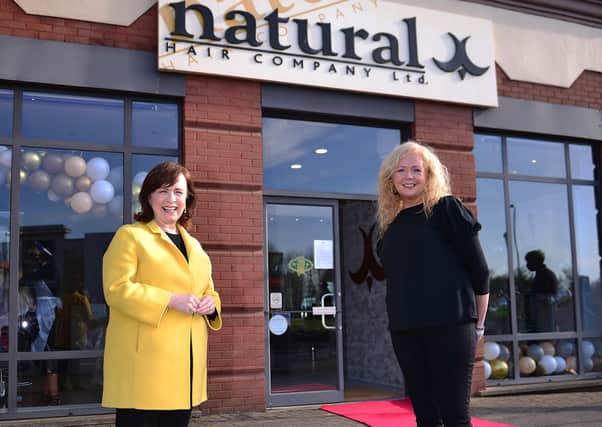Economy Minister Diane Dodds joins Martine Broggy, owner of Natural Hair Company as she re-opens for business