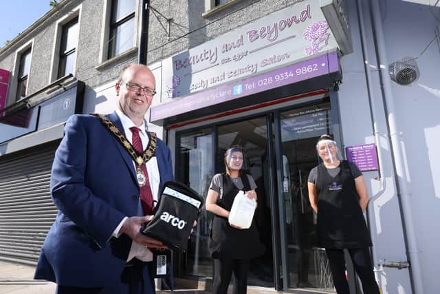 Mayor, Cllr Jim Montgomery delivers a Covid Pack to Beauty and Beyond, Ballyclare ahead of their Reopening.