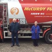 Cloughmills LOL 715 members George Forsythe and Jack Alexander delivering 1000litres of home heating oil to Betty Young winner of the lodge’s Christmas Draw