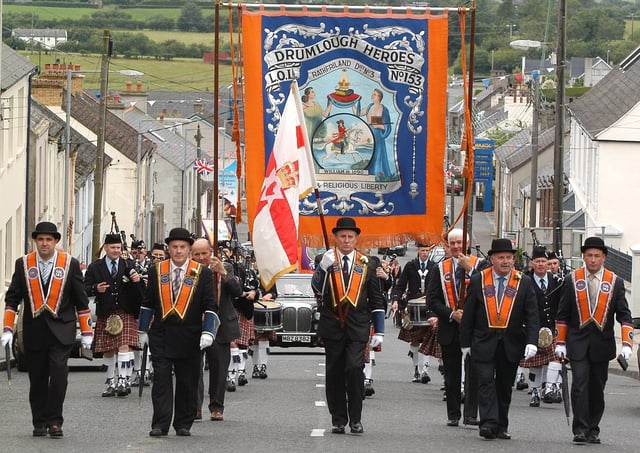 Rathfriland No 3 District officers accompanied by the Master and Deputy Master of Drumlough Heroes LOL No 153 lead the 12th morning parade in Rathfriland in 2005. Picture: News Letter archives