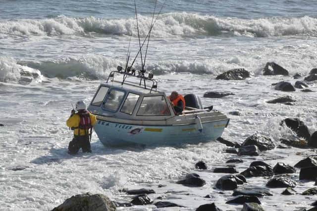 Red Bay RNLI rescue three people after fishing boat is grounded on rocks near Glenarm