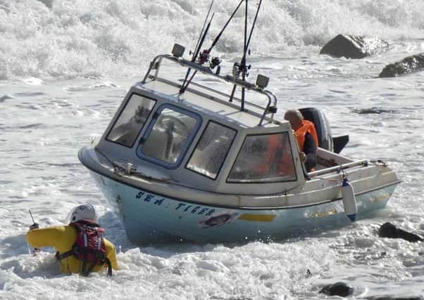 Red Bay RNLI rescue three people after fishing boat is grounded on rocks near Glenarm