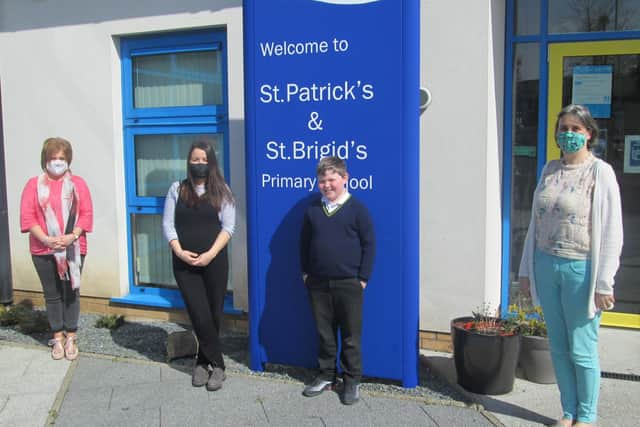 Rory Campbell with staff from St Patrick's and St Brigid's PS Ballycastle