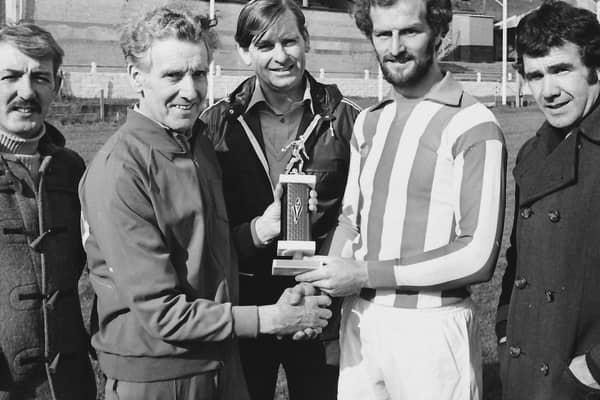 The late, great Terry Kelly, captain, Derry City FC, making a presentation on behalf of the club to trainer Dan Watson in recognition of his services to the Brandywell outfit.