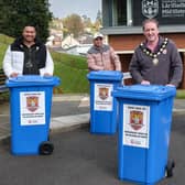 The Chair of Mid Ulster District Council, Councillor Cathal Mallaghan is pictured with members of TAIS (Timorese Association Inclusive Support) and Peace and Good Relations officer from the Council, with some of the household recycling bins donated to the East Timor aid relief.