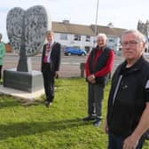 The Mayor of Causeway Coast and Glens Borough Council Alderman Mark Fielding pictured at the unveiling of the village’s new sculpture with members of the Articlave community who were involved in the initiative