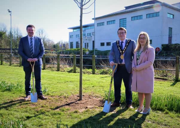 LIsburn Mayor Councillor Nicholas Trimble with the Mayoress and Concillor Scott Carson planting trees at the Civic Centre
