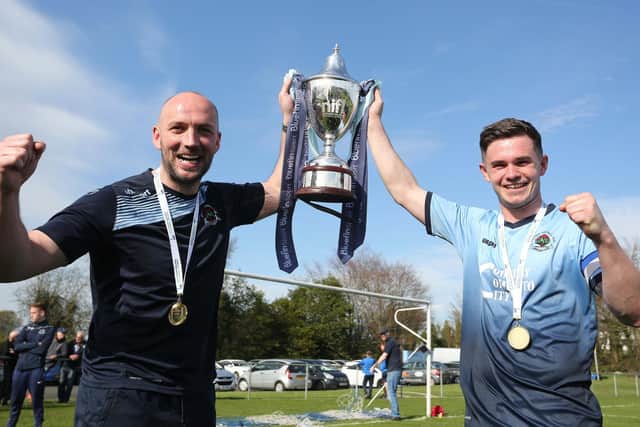 Institute manager Paddy McLaughlin and Michael McCrudden with the Bluefin Championship trophy in 2018.