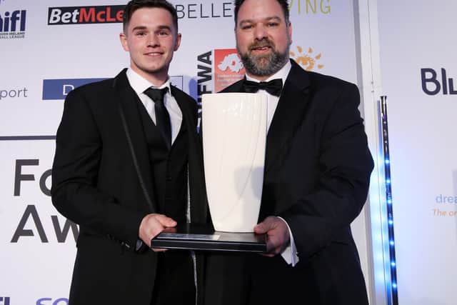 Michael McCrudden receiving the ‘Sodexo Championship Player of the Year’ from Derek Coulter in 2018, after playing a starring role in Institute’s title winning campaign.