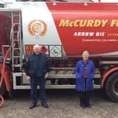 Cloughmills LOL 715 members George Forsythe and Jack Alexander delivering 1000litres of home heating oil to Betty Young winner of the lodge’s Christmas Draw.