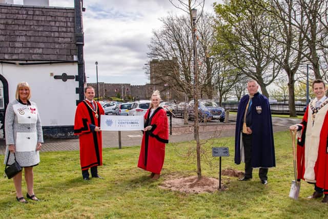 The Mayor, Councillor Peter Johnston, planted  a tree at Delaney's Green in Carrick,  to mark the centenary of Northern Ireland, included are council colleagues and  Deputy Lieutenant for Co Antrim Jacqueline Stewart MBE.