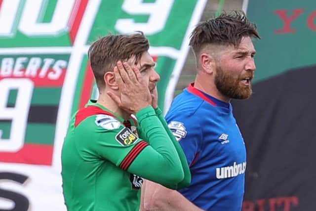 Robbie McDaid reacts to his penalty miss for Glentoran in Saturday’s scoreless draw against Danske Bank Premiership league leaders Linfield. Pic by Pacemaker.