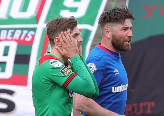 Robbie McDaid reacts to his penalty miss for Glentoran in Saturday’s scoreless draw against Danske Bank Premiership league leaders Linfield. Pic by Pacemaker.
