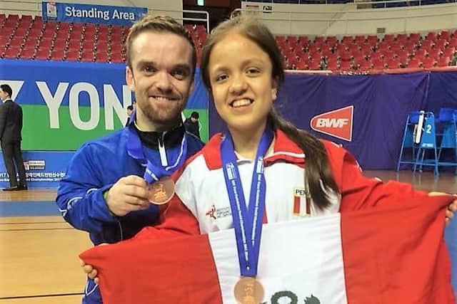 Niall pictured with Carmen Giuliana Poveda Flores with bronze medals after reaching semi-final of World Para-badminton Championships in 2017 in Korea