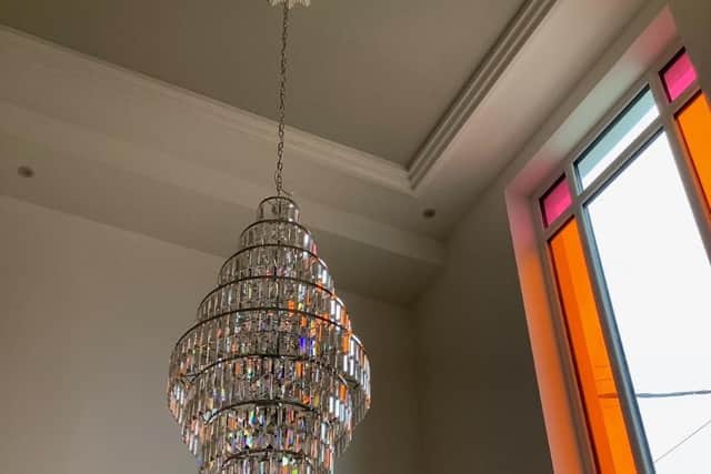 Art deco touches in the centre, including a chandelier.
