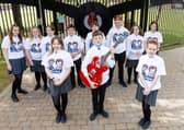 Glengormley High pupils wearing t-shirts designed by pupil Sienna Wilgaus .Pic by  Paul McIlwaine.