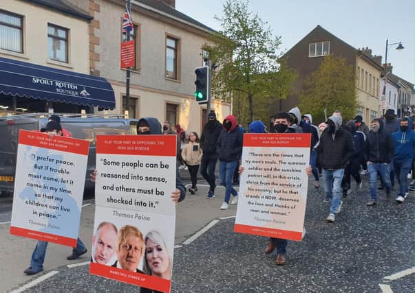 Placards citing Thomas Paine gathers at a rally against the Irish Sea customs border in Markethill on May 5, 2021.