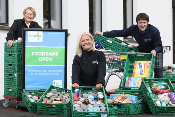 Margaret Haggan, volunteer; Alex Moore, project co-ordinator, Carrickfergus Foodbank and Jim Burke, director of sales and acquisitions, Hagan Homes.