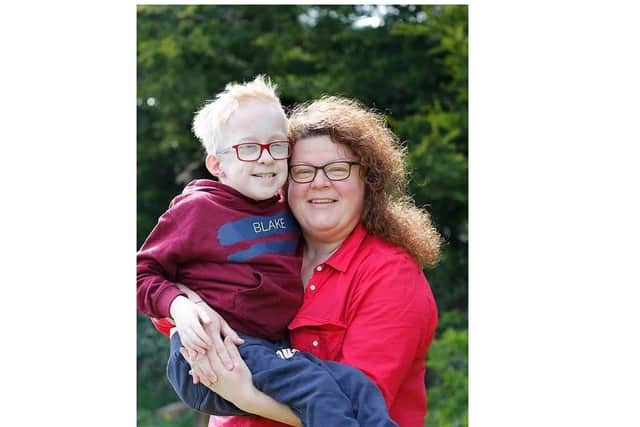 Blake McCaughey with his nurse Tracy Close.