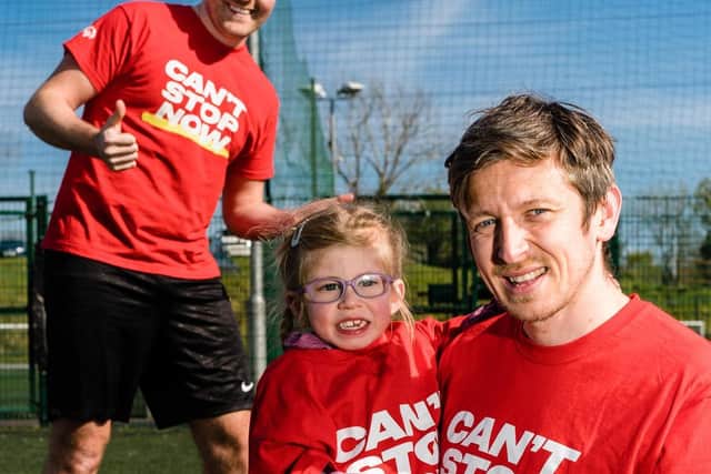 Sophia Sloan, aged 6, is pictured with her father Chris at the recent launch of the Special Olympics Collection Day fundraising appeal, with comedian Paddy Rafferty