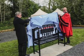 The, Mayor of Antrim and Newtownabbey, Councillor Jim Montgomery and Alderman Dr Fraser Agnew MBE unveiling the bench at Campbell Memorial Garden.