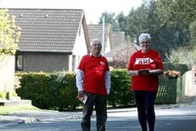 (L-R) Kelvin McCracken and June McDowell prepare to resume their annual Christian Aid Week house-to-house collection as lockdown restrictions ease