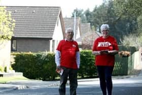 (L-R) Kelvin McCracken and June McDowell prepare to resume their annual Christian Aid Week house-to-house collection as lockdown restrictions ease