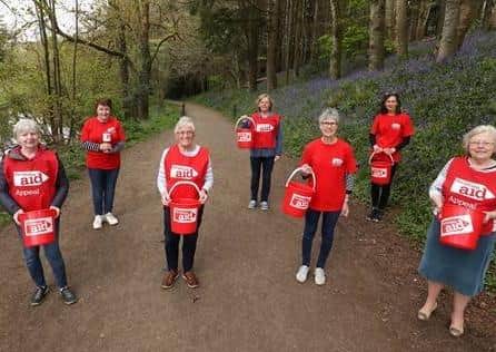 Seven Garvagh women prepare to begin a 75 km sponsored walk through the village and nearby forest while carrying buckets of water, to mark Christian Aid Week. They are Moira Irwin (centre) and L-R Joyce Workman, Rachel Henderson, Jenny Farlow, Rachel McCormick, Doreen Campbell and Ivy Thompson