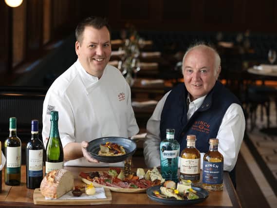Hinch Distillery Head Chef Leo Small is pictured with Dr Terry Cross OBE