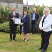 The Mayor of Causeway Coast and Glens Borough Council Alderman Mark Fielding and Mayoress Mrs Phyllis Fielding present a framed Coat of Arms to representatives of Garvagh Clydesdale and Vintage Vehicle Club including treasurer Andrew Wilson, Chairman Nevin Smith, Vice Chairman Gerald Stewart and Secretary Michelle Knight-McQuillan