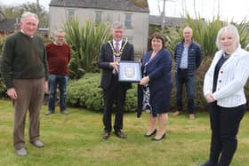 The Mayor of Causeway Coast and Glens Borough Council Alderman Mark Fielding and Mayoress Mrs Phyllis Fielding present a framed Coat of Arms to representatives of Garvagh Clydesdale and Vintage Vehicle Club including treasurer Andrew Wilson, Chairman Nevin Smith, Vice Chairman Gerald Stewart and Secretary Michelle Knight-McQuillan