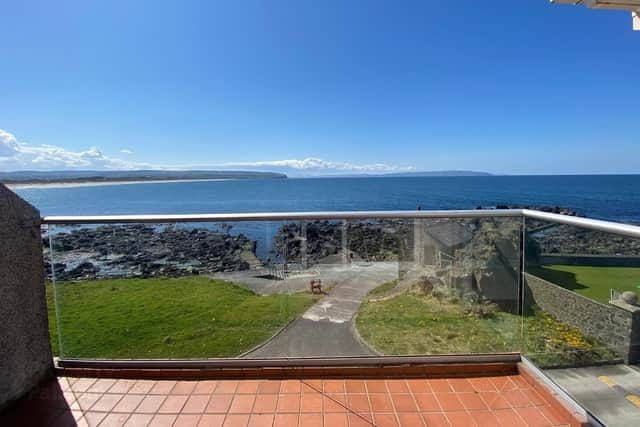 The tiled veranda offers a remarkable panoramic sea