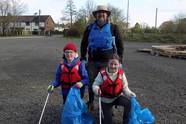 L-R CAPS members Dave Harrison with daughters Martha & Evie Harrison setting off on their litter pick
